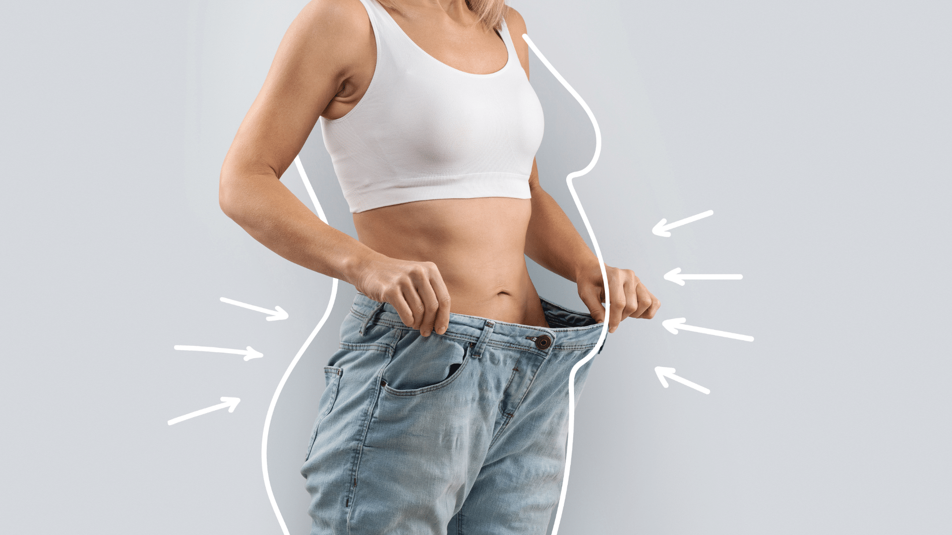 Individual holding oversized jeans to represent measurable weight loss outcomes discussed in Does Oral Semaglutide Work clinical trial findings